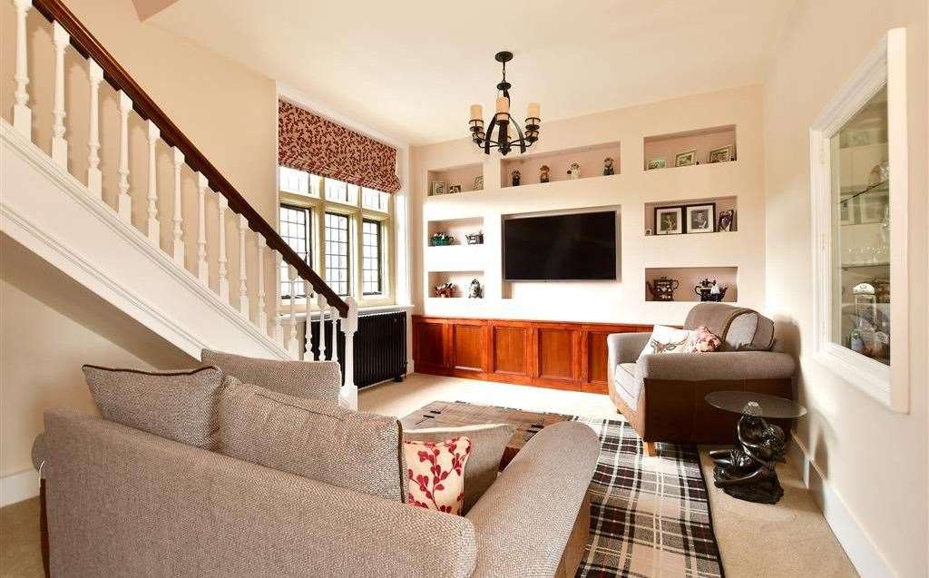 The cosy sitting room with a staircase leading up to the first floor. Picture: Fine and Country