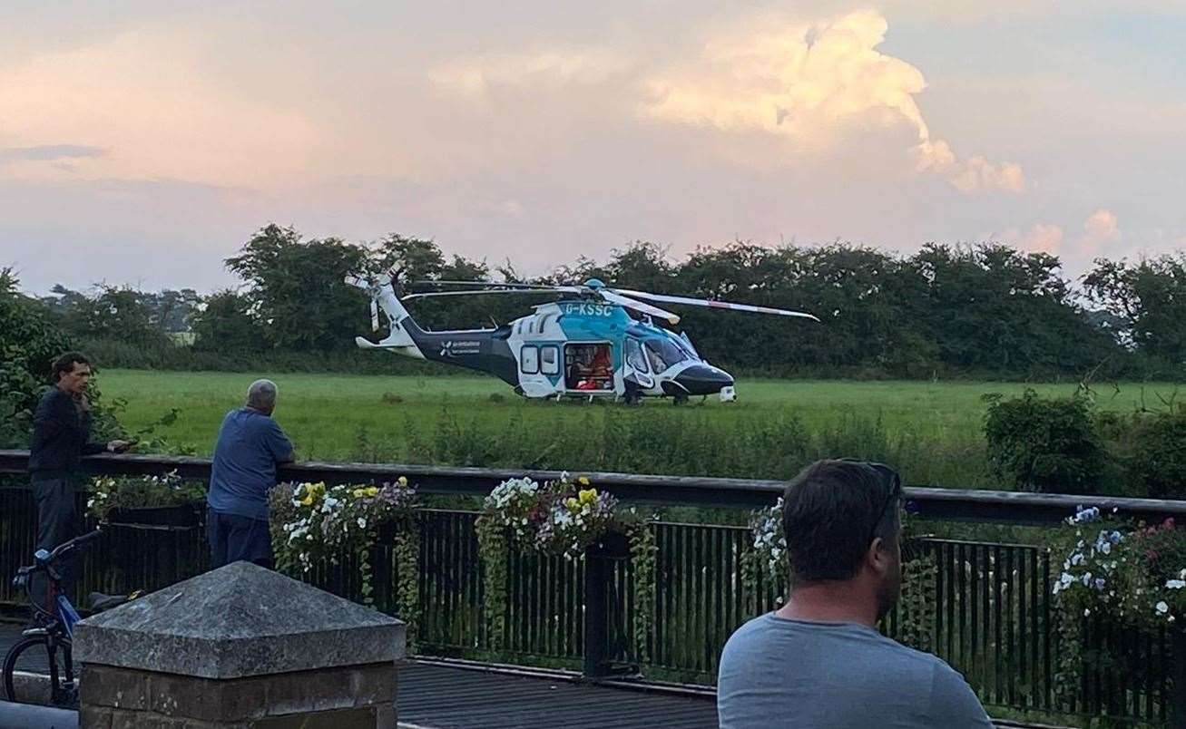 The air ambulance landed in a field off Dover Road, Sandwich, near the town's railway station