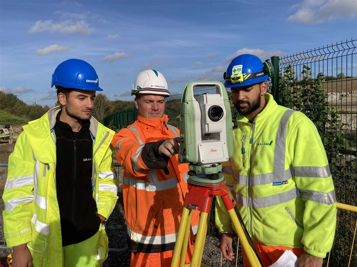Civil engineering degree students Taimur Kham, 20, (left) from Leeds and Vinay Chawla, 20, (right) from Birmiingham get some practical experience on the M2 A249 construction site at Stockbury from tutor Paul Clarkson. Picture: John Nurden (60444911)
