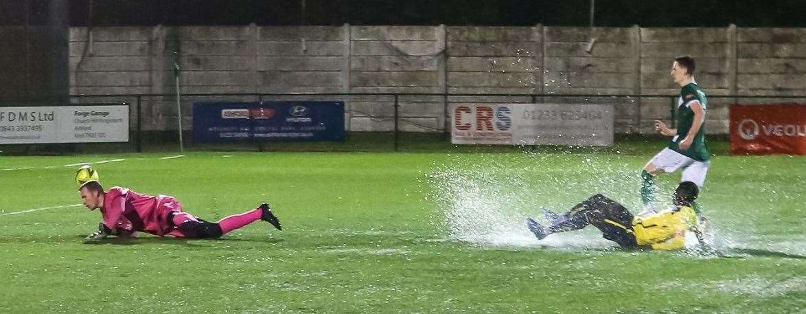 Muhammed Cham slides in during Whitstable's 4-0 Kent Senior Cup defeat at Ashford on Tuesday night. Picture: Les Biggs