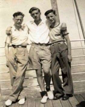John (centre) with two members of the group onthe way to Australia in July 1950.