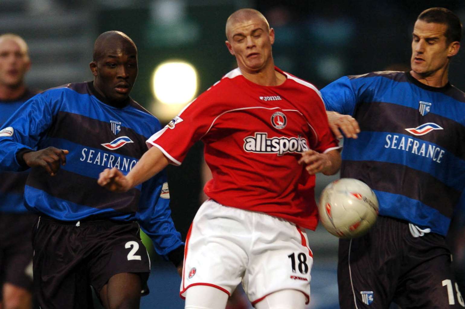 Paul Konchesky, centre, challenges Gillingham's Nyron Nosworthy and Chris Hope while playing for Charlton