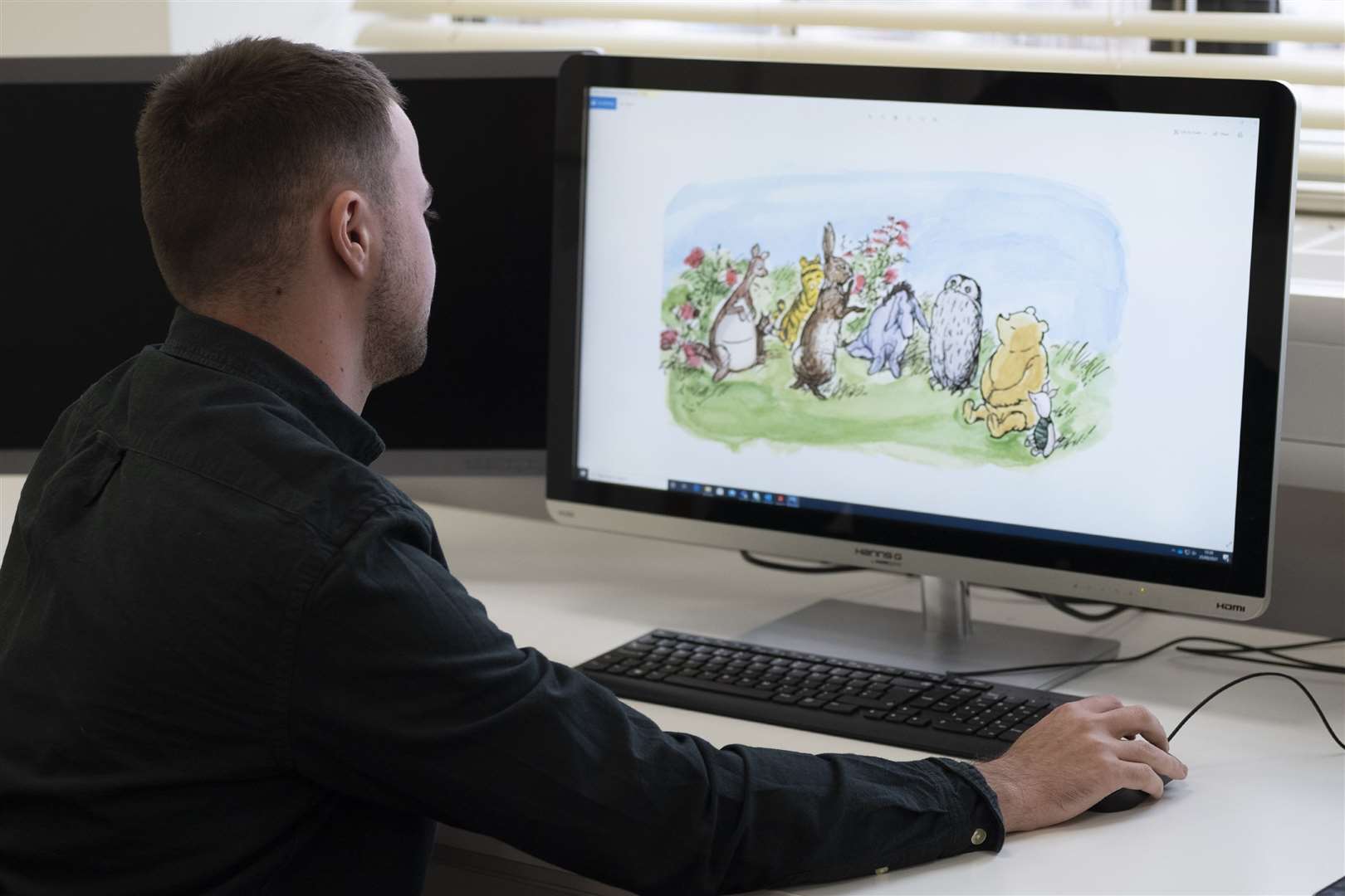 The Royal Mint designer Daniel Thorne working on the Winnie the Pooh 50p collectable coins