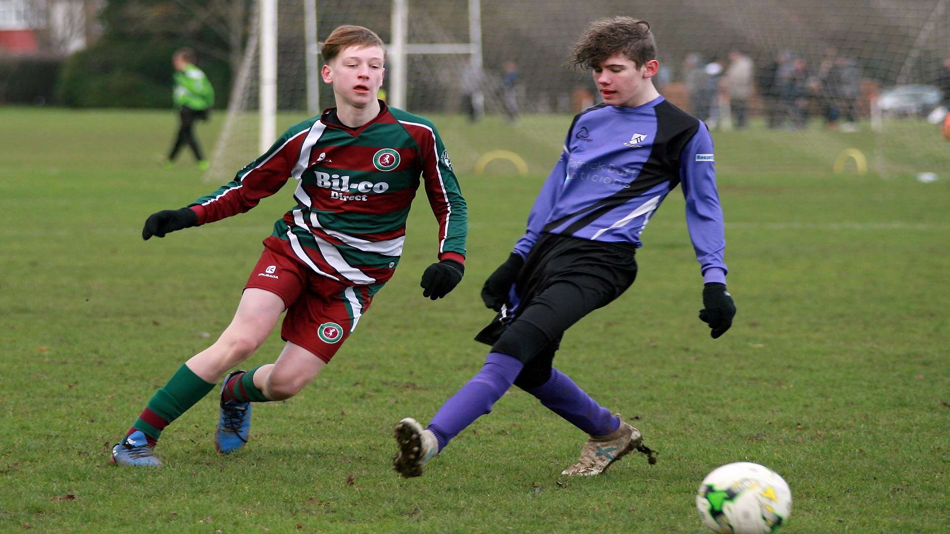John Leeds action as Anchorians United under-15s (purple) clash with Cobham Colts under-15s Picture: Phil Lee