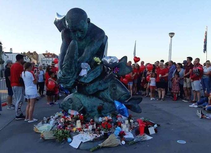 The mass of tributes around the Deal Pie statue, August 23.