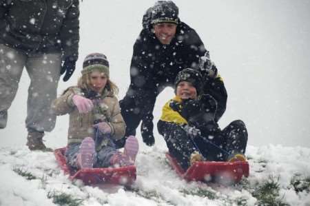 Children sledging in the snow in Larkfield. Picture by Matt Walker