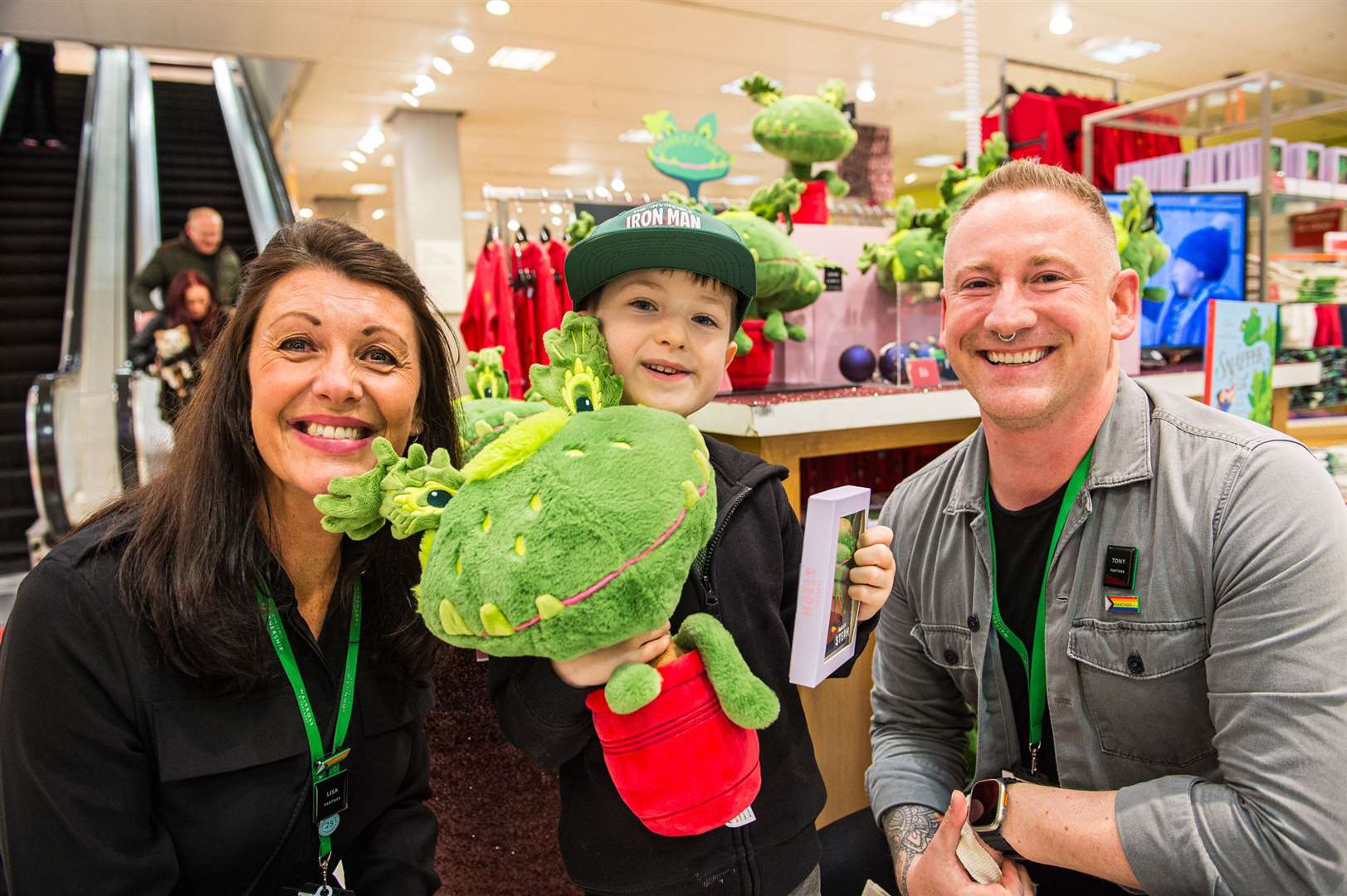 Tommy at John Lewis in Newcastle pictured with deputy branch manager Lisa Kennedy and head of the branch Tony Righelato, holding his Snapper teddy (Caters Photographic/PA)