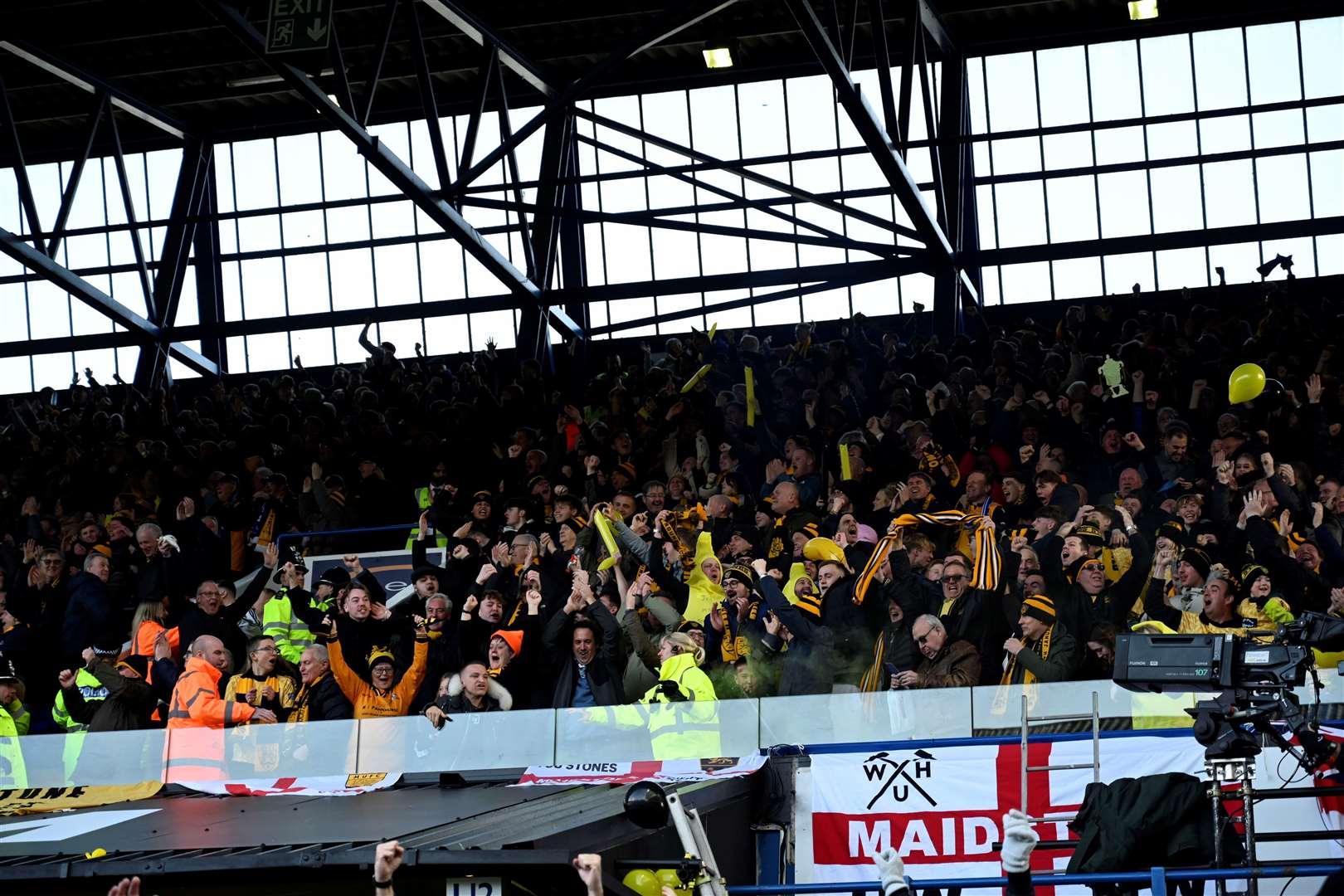 Maidstone supporters celebrating their victory at Portman Road. Picture: Barry Goodwin
