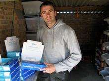 Aaron Sellens in the garage where his boxes of charity sweets were stolen