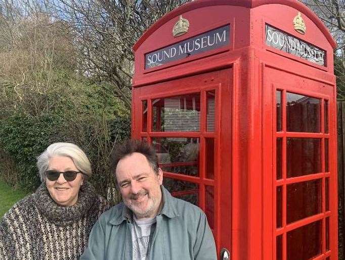 Jackie King and Rob Pursey in Rolvenden Layne with the phone box they converted to a Sound Museum