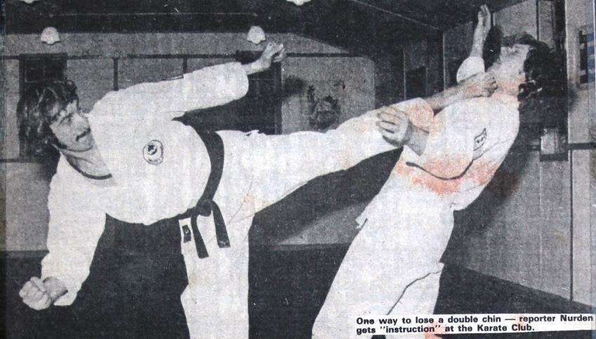 Arthur Wallace aims a karate kick at reporter John Nurden