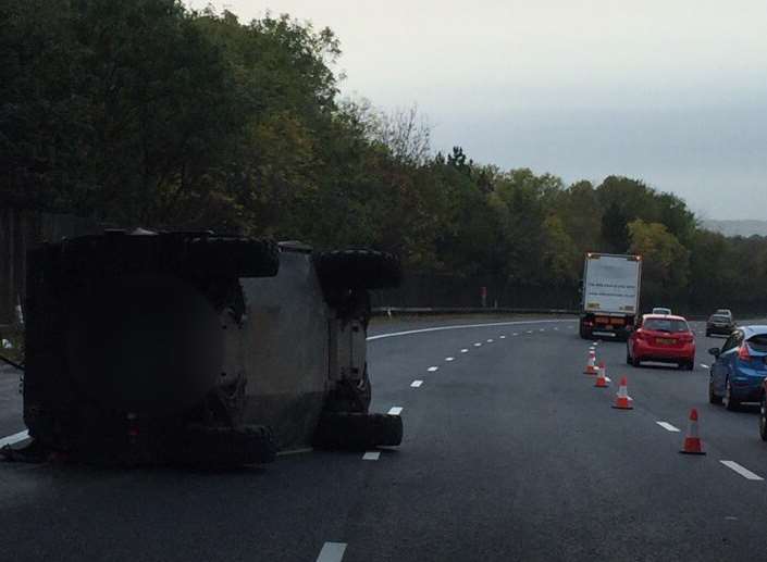 The overturned army vehicle. Picture: @kentpoliceroads
