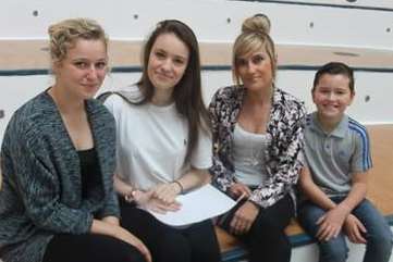 Ellie Summerfield (second from left) with her results and her family at Marlowe Academy