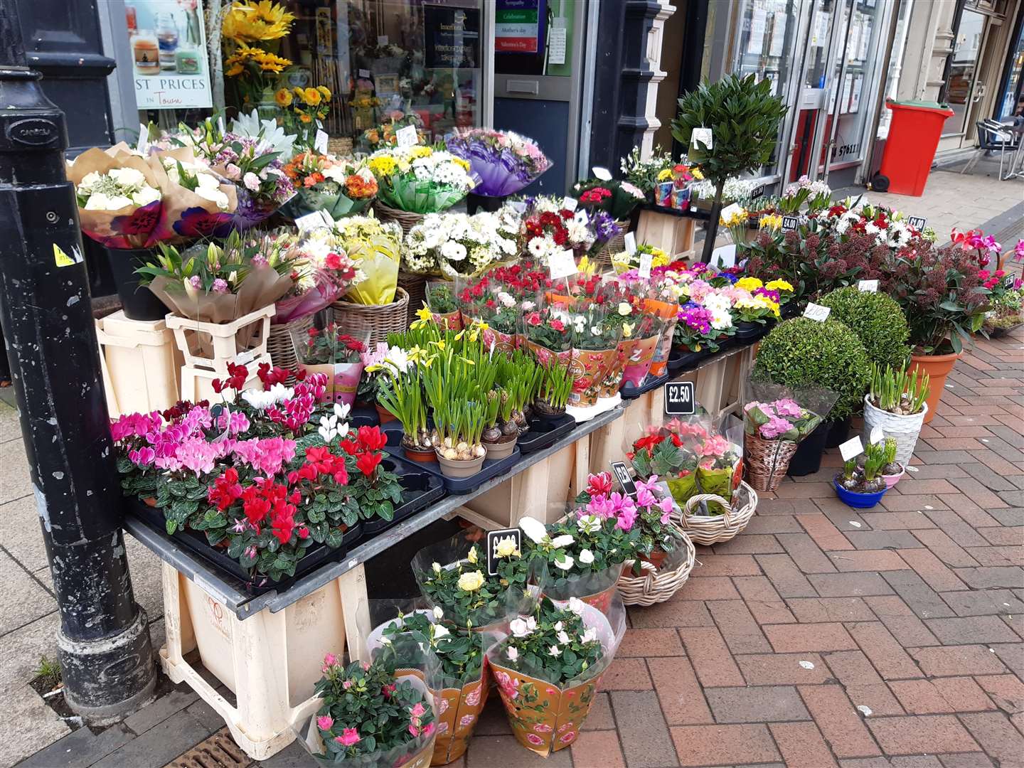 Mr. Flowers with flowers in plastic wrapping, High Street, Gillingham