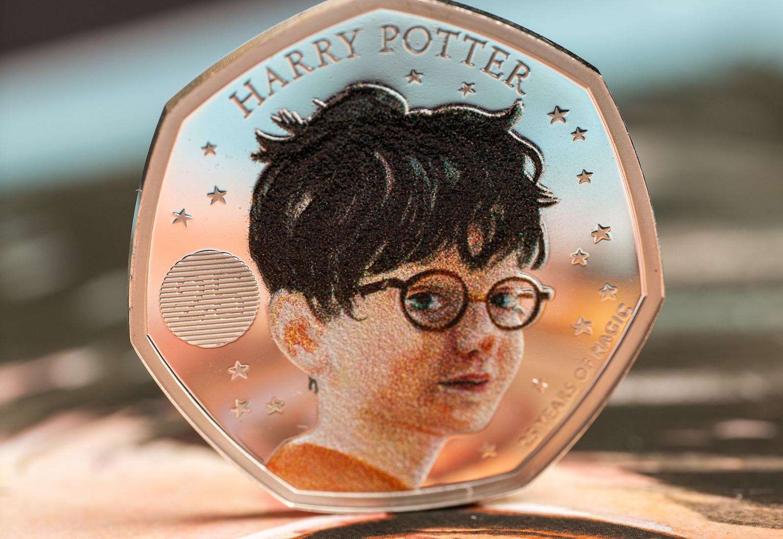 The first coin - featuring Harry Potter - is available to buy from today