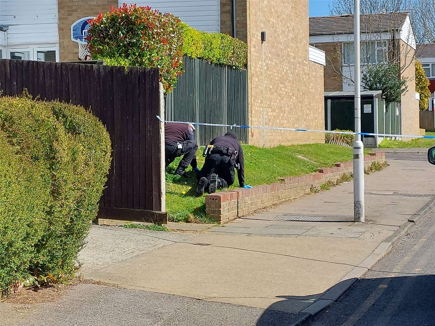 Police were spotted searching a grass verge in Downs Road, Canterbury, this morning