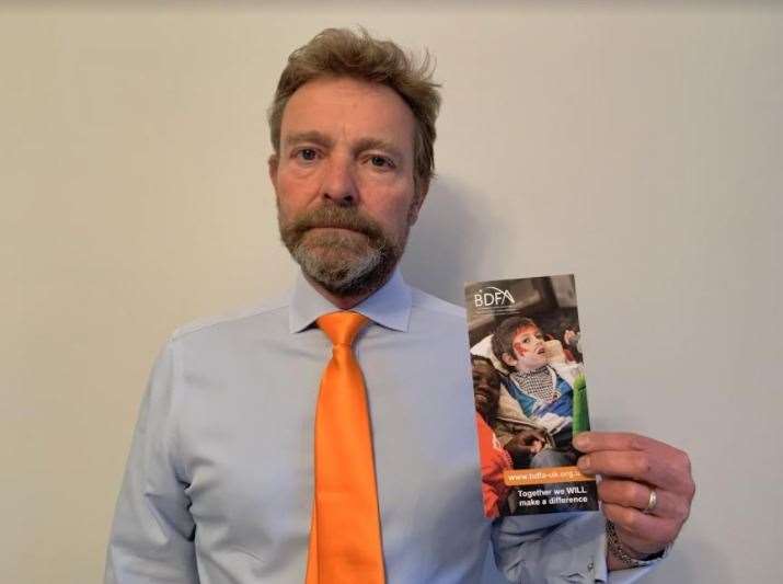 MP Craig Mackinlay dons orange in support of Ash resident 14 year old Ash resident Ryan Buggins on Batten Disease Awareness Day