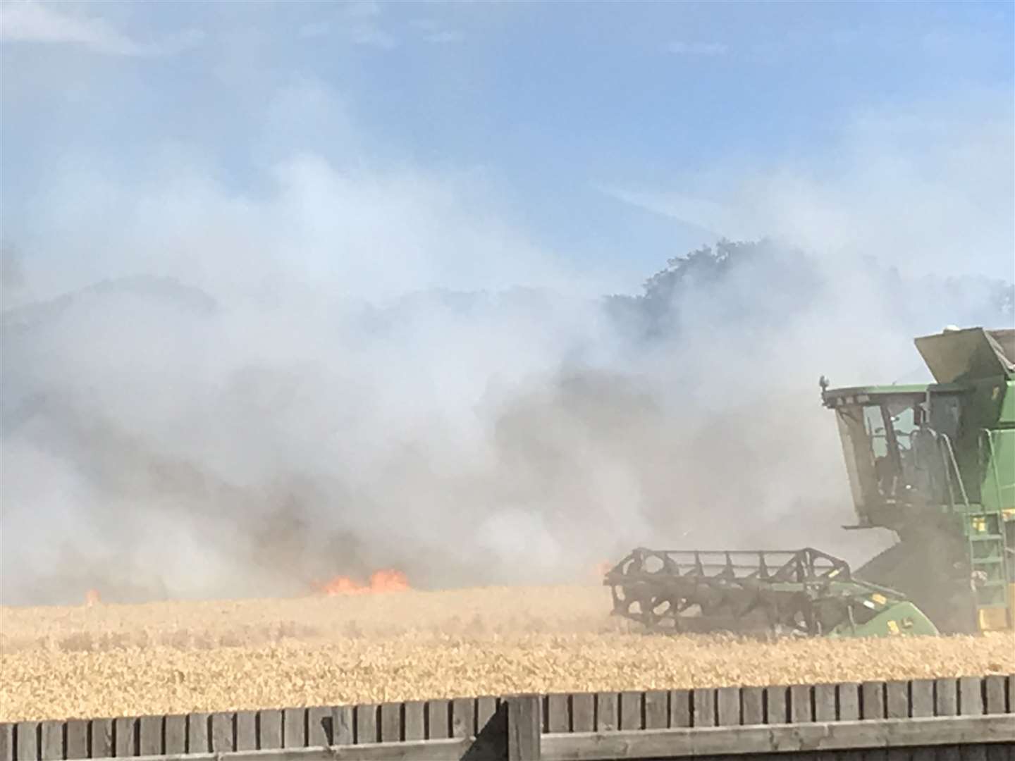 Farmers used a tractor to try to slow the spread of the Chartham blaze. Picture: Adam Pond