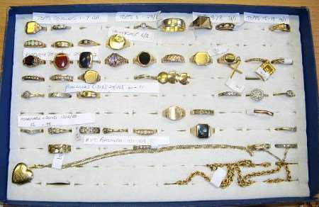 A collection of rings and a pendant recovered by police from pawn shops