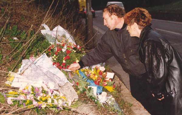 NEVER FORGET: Claire’s parents Cliff and Linda lay flowers on the first anniversary of their daughter’s death in 1994