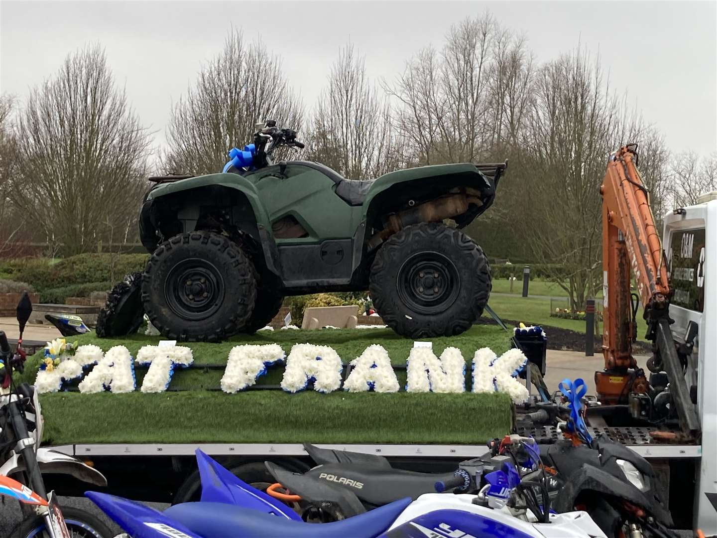 Flowers spelled out Fat Frankie at car mad Frankie Wright's funeral at the Garden of England crematorium
