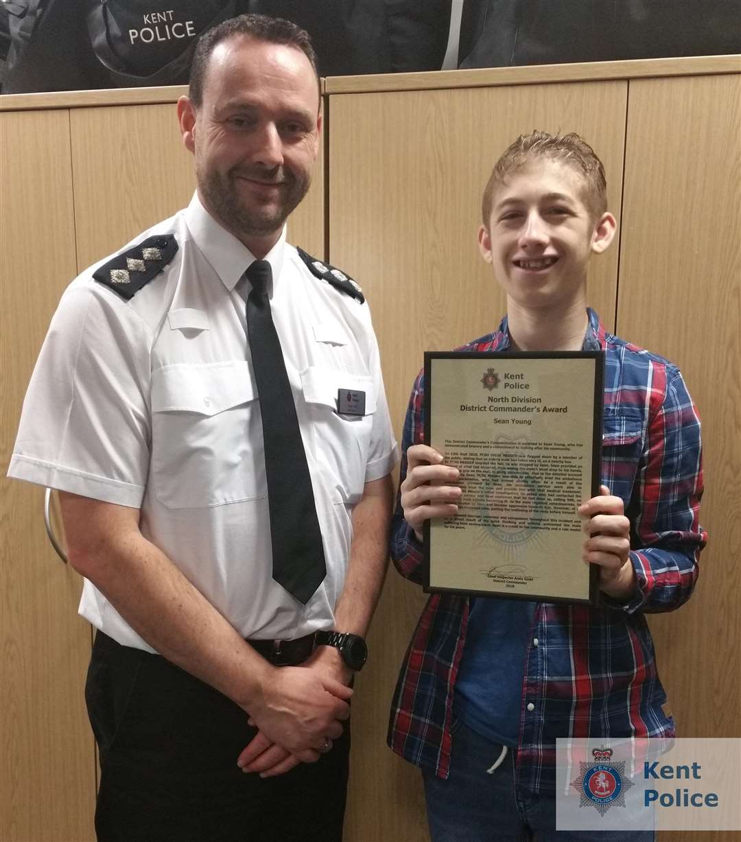 Chief inpector Andy Gadd with hero Sean Young, 17. Image: Kent Police. (6183523)