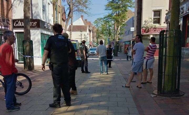 Police stand guard around a cordon in Chatham High Street Picture: Nicola Cochran