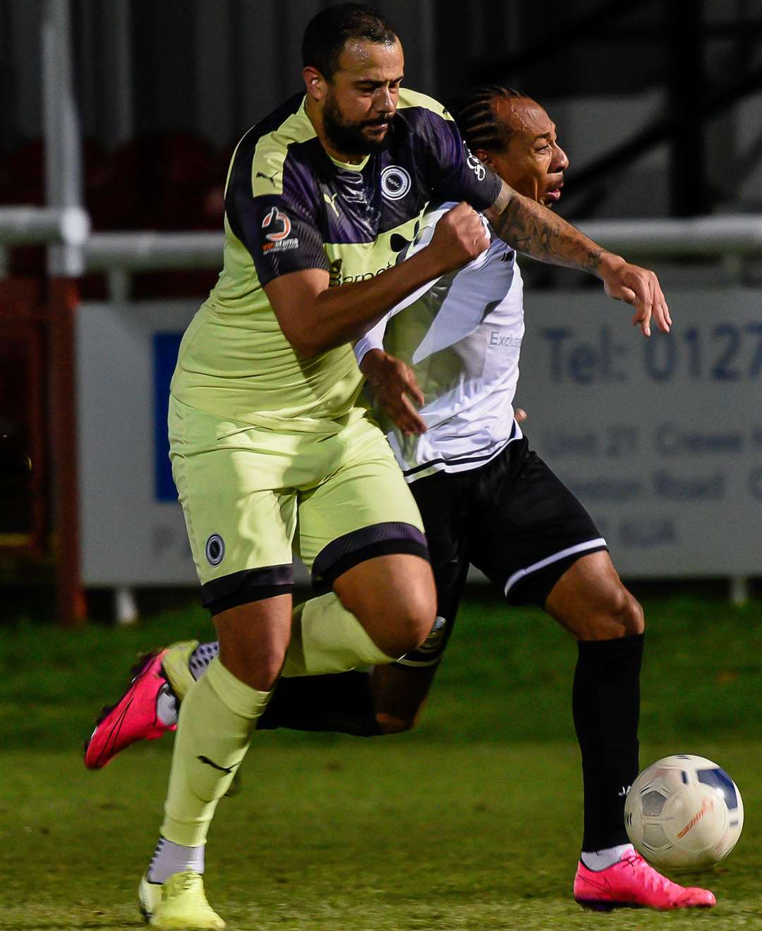 Dover's Ricky Modeste tries to find a way past Boreham Wood defender David Stephens Picture: Alan Langley