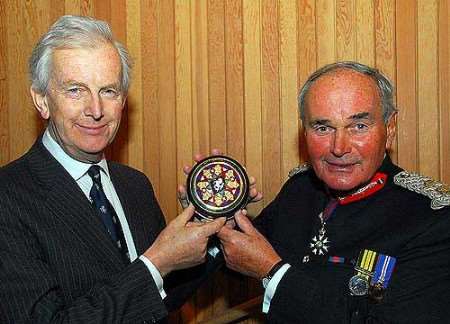 Sir Sandy Bruce Lockhart receiving the award from the Lord Lieutenant of Kent Allan Willett. Picture: BARRY DUFFIELD