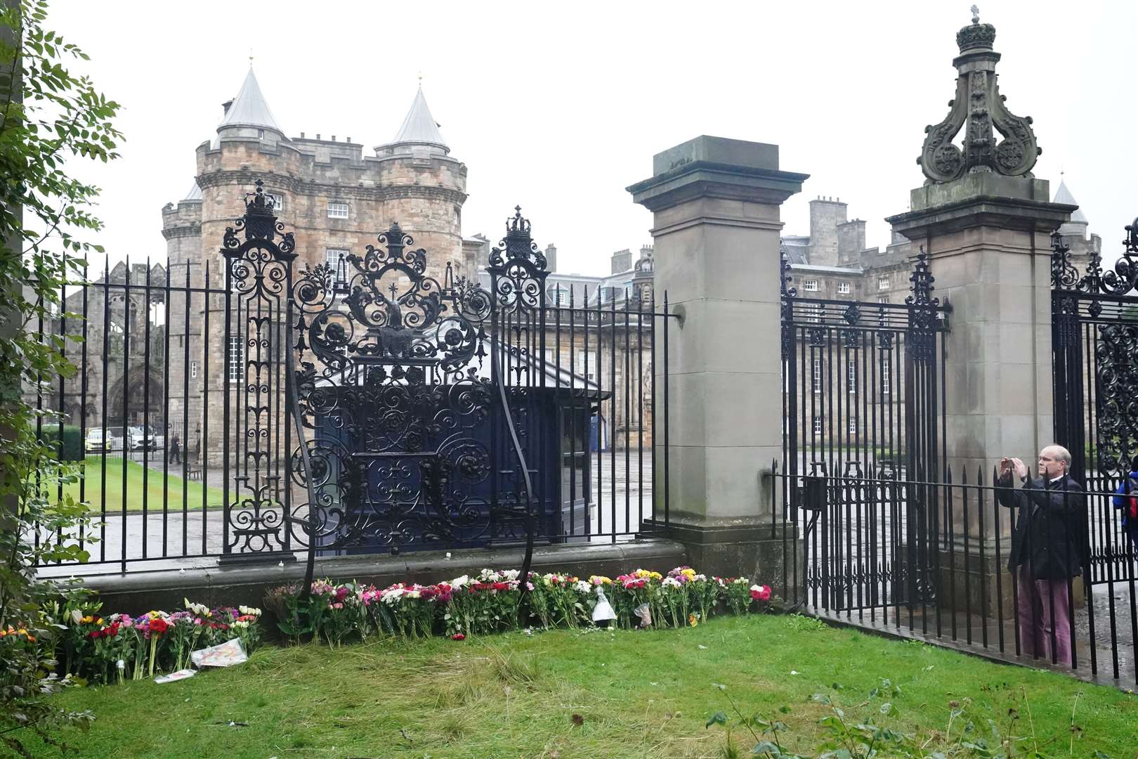 Floral tributes outside the Palace of Holyroodhouse in Edinburgh (Jane Barlow/PA)