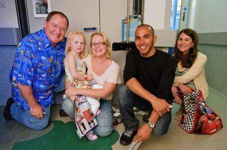 Great Ormond Street Hospital patient Liana aged 4 and her mother from Kent meets John Lasseter, Chief Creative Officer Walt Disney and Pixar Animation Studios and Director of Cars 2, British Formula One driver, Lewis Hamilton and Denise Ream, Producer of Cars 2