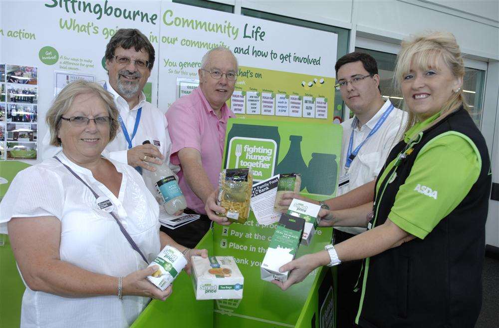 Ceri and Chris Norman with John Fowler, of Children and Families Ltd, Cllr Lee Burgess and Claire Fosbeary, Asda's community life champion at the family foodbank collection