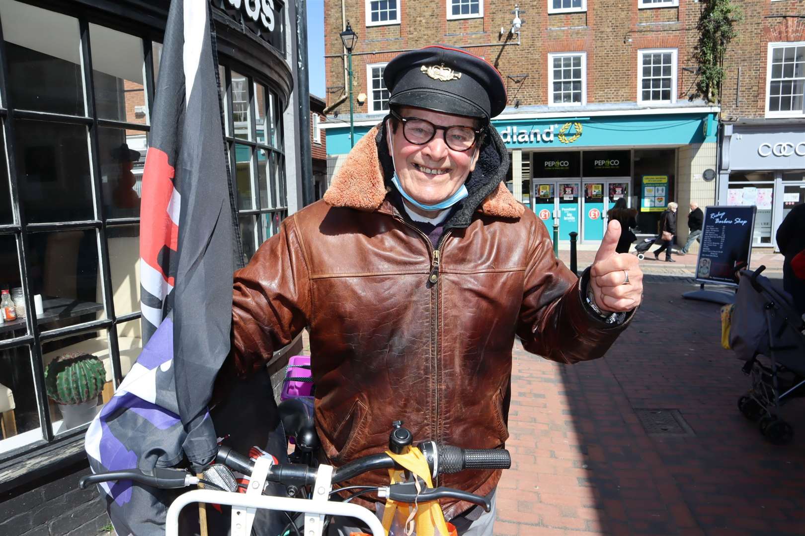 Sittingbourne's 'whistling postman' Dale Howting is smiling again in Roman Square after kind-hearted supporters raised more than £2,000 after he had a day's charity takings stolen from his bike