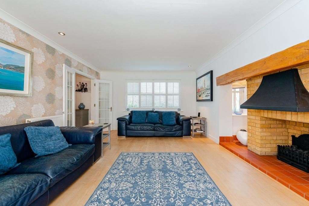 The downstairs area includes this spacious sitting room