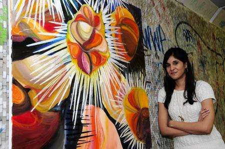 Alessia Di Mare, 20, with her acrylic painting representing sea urchins in the St George's subway