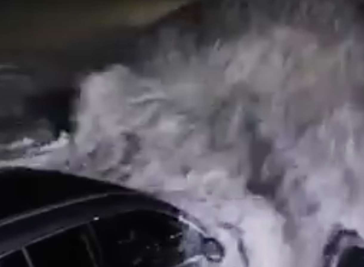 The video shows cars parked near the sea being battered by the waves. Picture: Sophie Ainslie