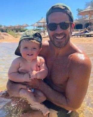 Former footballer Jamie Redknapp, who spent his summer holidays on Sheppey, pictured with his new son Raphael on a slightly more luxurious beach. Picture: Instagram/@frida_redknapp