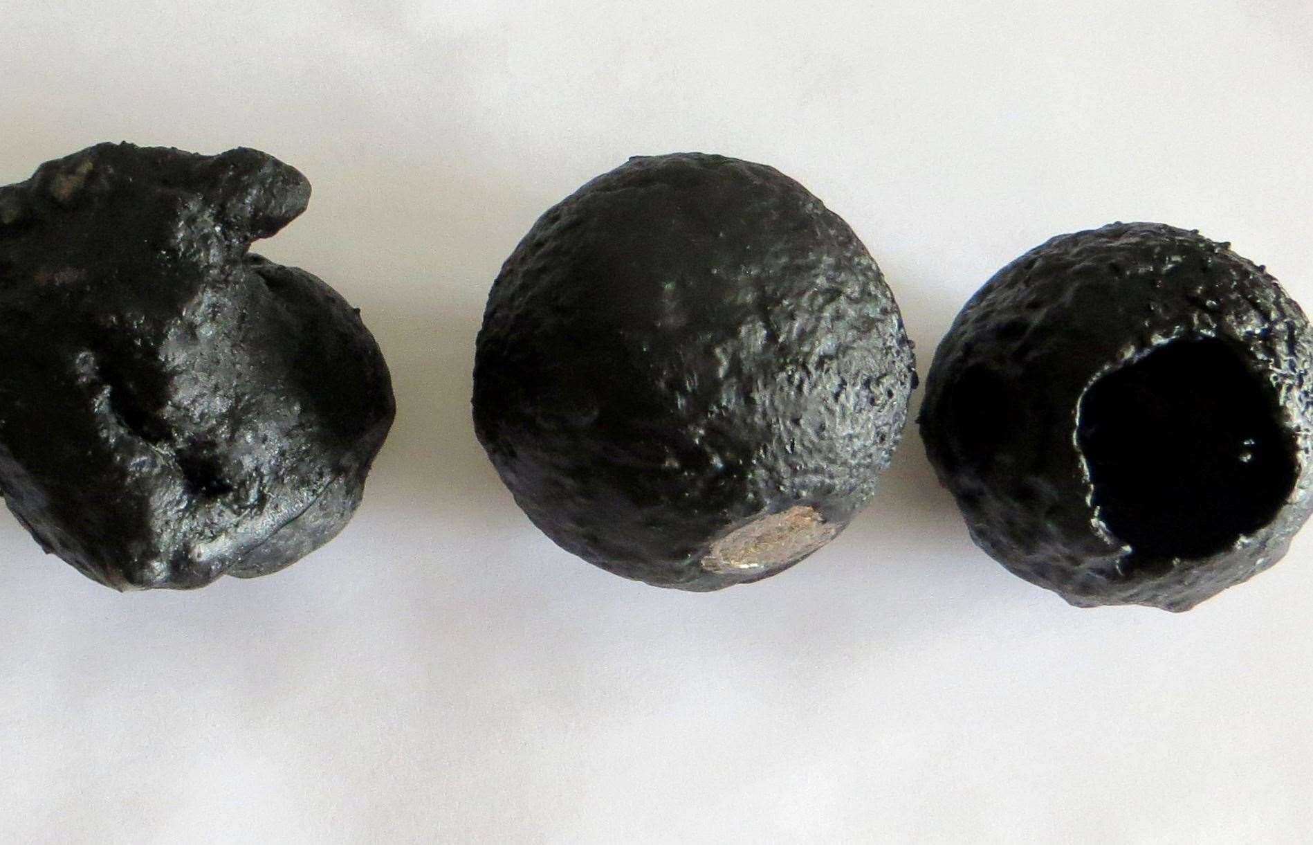 An enlarged 3D printed version of the micrometeorites - the severity of the melting they undergo while entering the atmosphere makes them more spherical - as seen on the right. Picture: Matthias van Ginneken