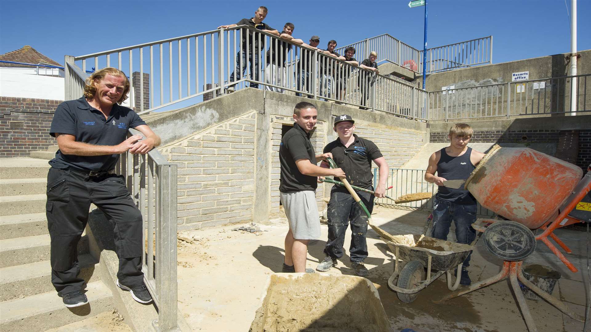 Swale Council's seafront officer Ian Arnell, left, with students and staff at the stairwell