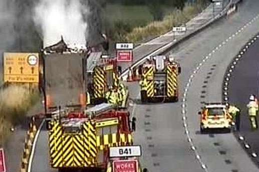 Emergency services at the scene of the lorry blaze on the M25. Picture: Highways Agency