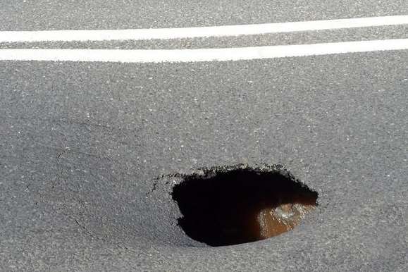 Grovehurst Road, Kemsley, was closed in both directions after this hole opened up