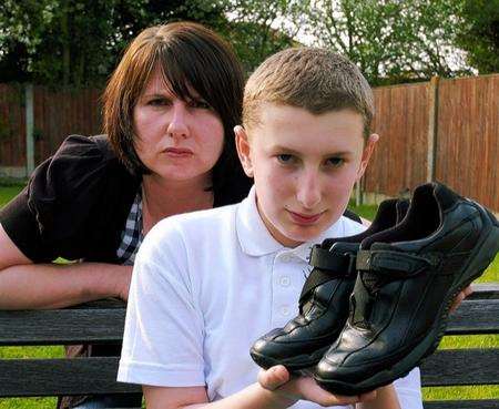 Terasa Groves with son Oliver, 11, who was sent home from school for wearing the wrong shoes.