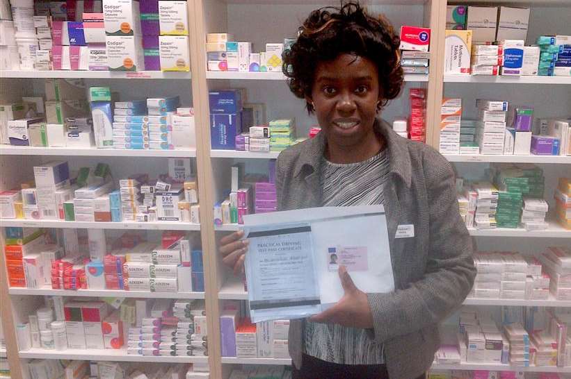Blessing with her driving licence at the pharmacy where she works