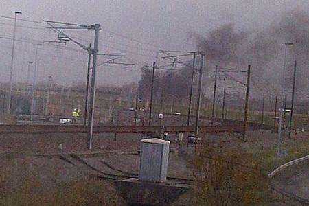 Smoke billows from a vehicle at the Channel Tunnel entrance in France. Picture: Kent_999s on Twitter