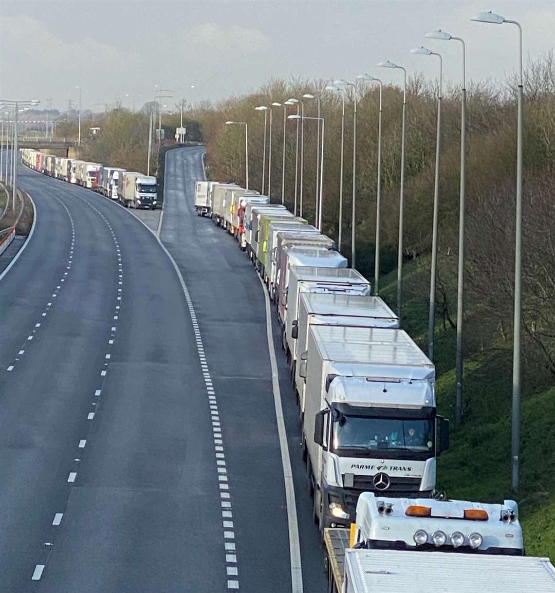 Lorries queue on the M20 near junction 11 yesterday whilst they await being able to board at the Eurotunnel terminal. Picture: Barry Goodwin.