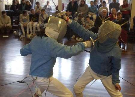 Fenella McLuskie and Meghan Rorison in action at the sabre fencing tournament. Picture: CHRIS DAVEY
