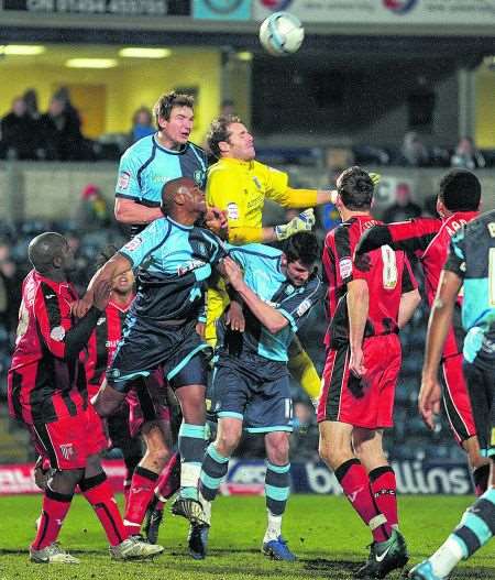 Gillingham keeper Alan Julian joins the attack in the game against Wycombe. January 3 2011