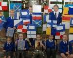 Children from All Saints primary school in Wouldham recreate Nelson's message with signal flags. Picture: VERNON STRATFORD