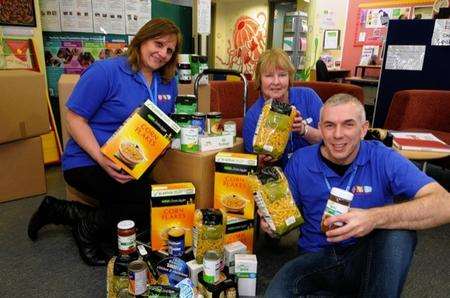 Steve Chevis, Diana Partington and Eileen Jackson, from Seashells Children and Families' Centre, with food parcels for Thamesteel workers