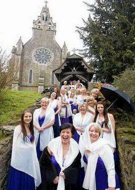 Wedding with 27 bridesmaids dressed in purple of a couple who will be Mrs Pullinger-Legg and Mr Legg.